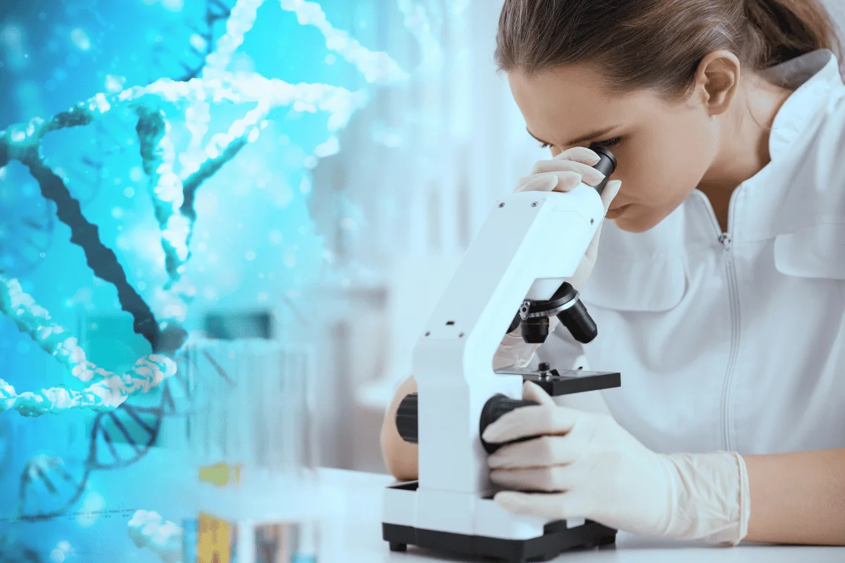 Female scientist examining samples through a microscope with a DNA strand overlay.