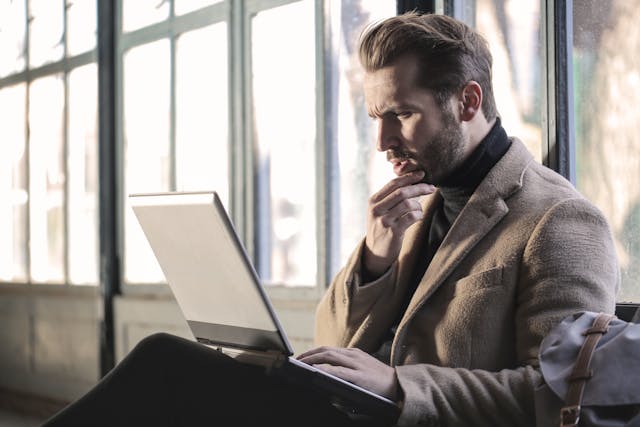 Man thinking on his computer