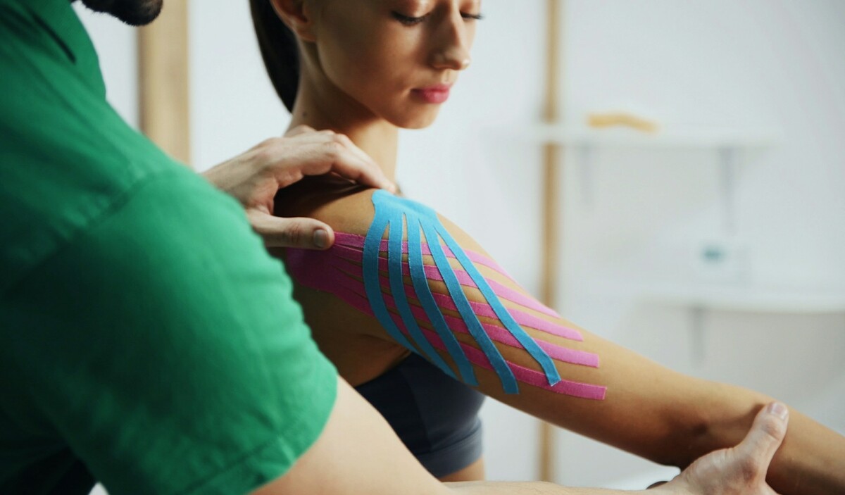Woman undergoing injury recovery protocol in a clinic.